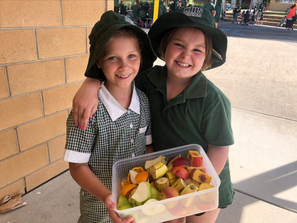 School girls with fresh fruit